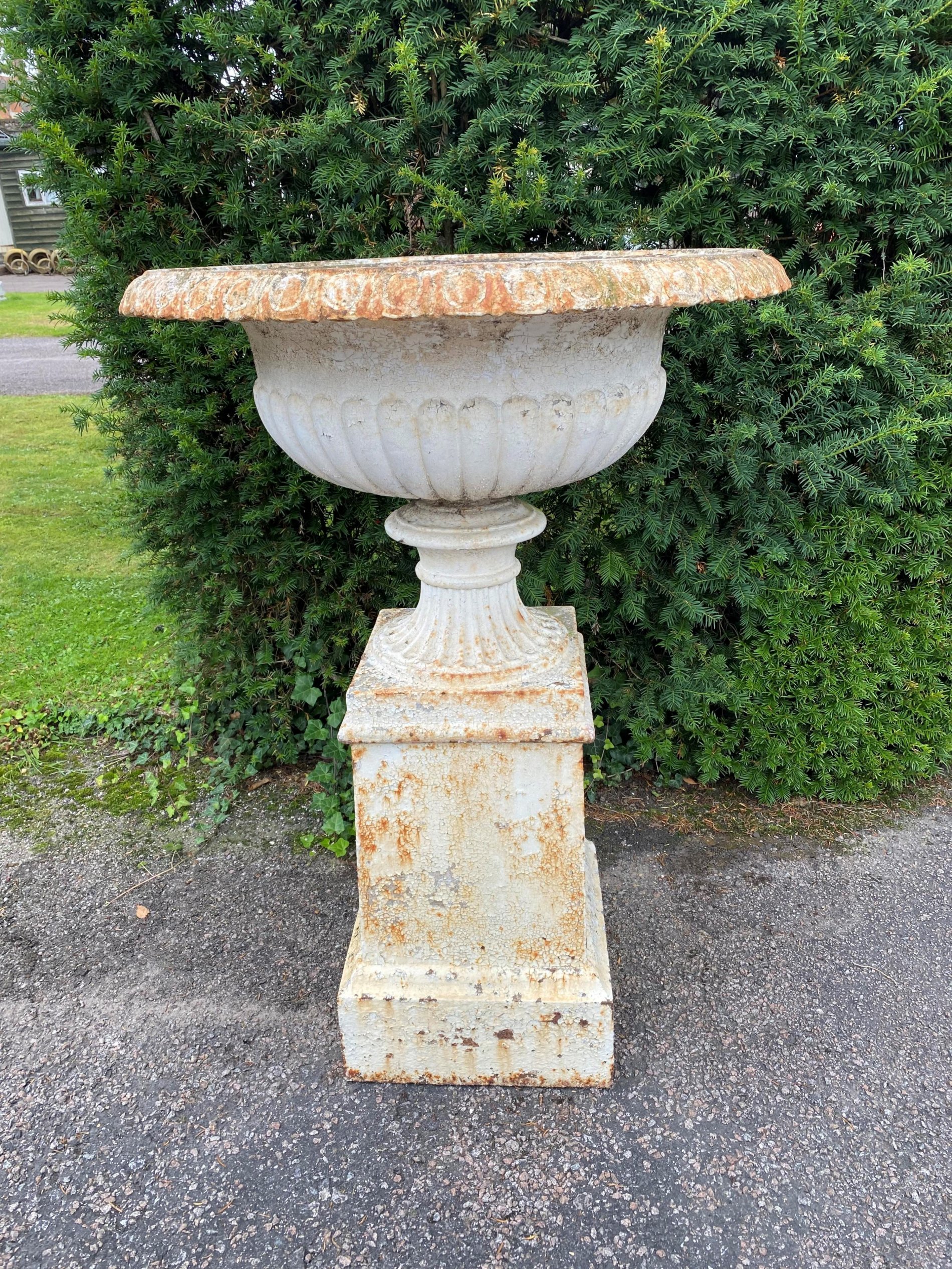 A similar smaller Handyside foundry cast iron urn on pedestal