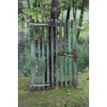 Two green painted wooden gates