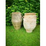 A pair of terracotta storage jars