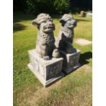 A pair of compostion stone dogs of Fo