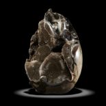 A black septarian geode egg shaped