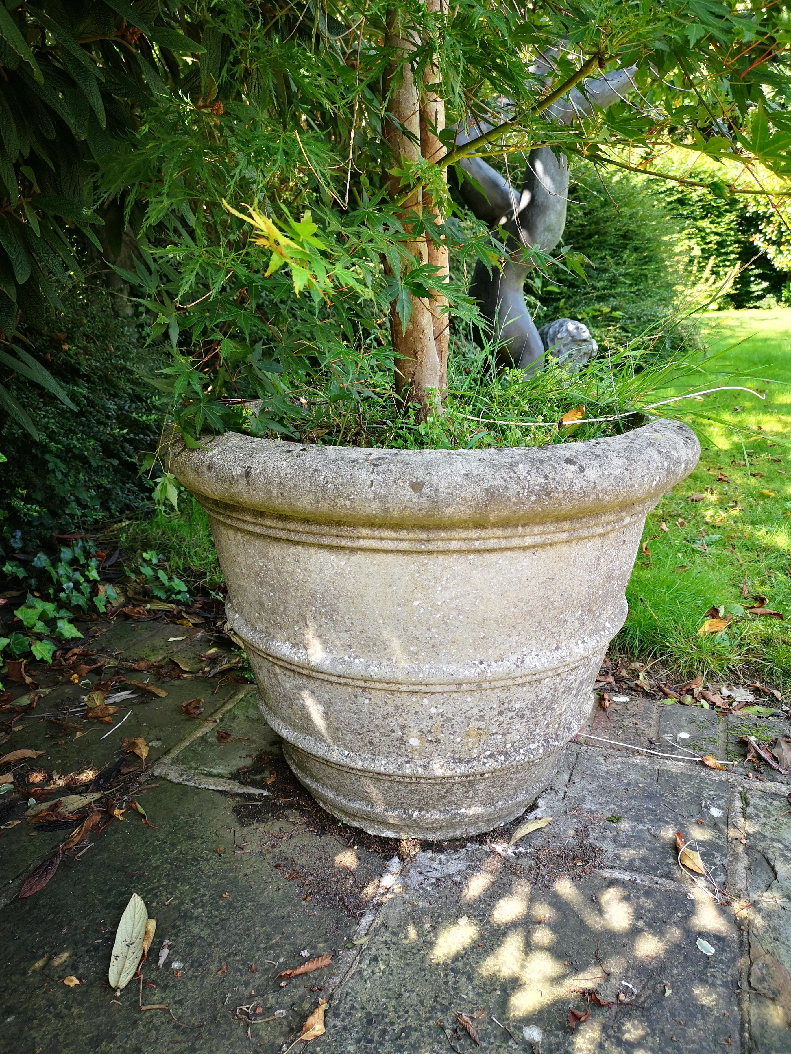 A similar smaller pair of composition stone tapering cylindrical planters