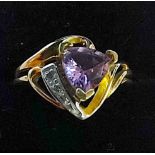 10ct gold designer ring purple heart shaped centre stone with a shoulder of white stones set in