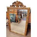 Gilt mirror with feather decoration in excellent condition The size of the mirror is 72 x 118 cm
