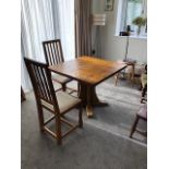 An rare Mouseman square dining table with adzed top to seat 4 made in 2013 with two chairs