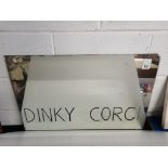 A vintage shop mirror engraved with Dinky & Corgi