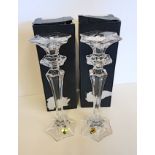 A pair of Watertford Crystal candle sticks with boxes