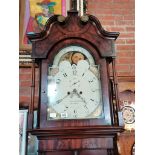 An 8 day longcase clock with painted face by R Lawson Hindley