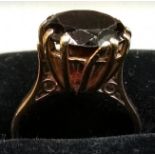 9ct gold ring with 4ct dark red stone possibly garnet size L