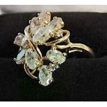 14k gold designer ring with 12 white stones set in yellow claws size S