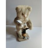Antique mechanical cat with glass eyes hitting a boot (in working order, little bit of fur missing