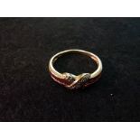 9ct love cross ring with diamonds and a band of red square stones size O