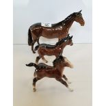Beswick huntsman's horse in brown, small shire foal in brown and large stretched foal in brown