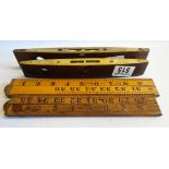 2 wooden extending tape measures and 2 antique wooden and brass spirit levels