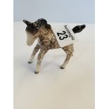 Small Beswick foal facing left in rocking horse grey