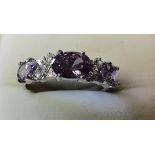 14k white gold ring with 3 purple stones with centre white stones size N