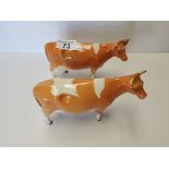 First Version Beswick Guernsey Cow with Second version Guernsey cow (small restoration on both)