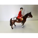 Beswick huntsman standing four square on brown horse