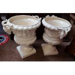 Pair of large 46cm urns with rams head decoration