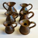 6 Copper measuring jugs with lead seals