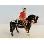 Beswick Canadian Mountie on black horse