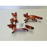 3 x small Beswick foxes 2 running, 1 sitting