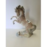 Lladro horse and squirrel (no understamp but page out of Lladro book showing rarity)