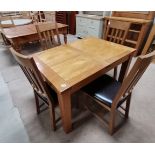 Modern extending light oak dining table and 4 chairs