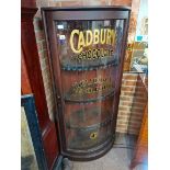 A 5ft foot floor standing display cabinet with CADBUYS choclate marked on the glass