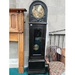 oak Grandmother clock with brass face and carved flower decoration
