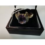 9ct gold ring size N with large purple stone with white stone shoulders
