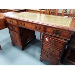 Small mahogany with green leather writing desk