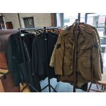 large collection of old military uniforms, fur coats etc