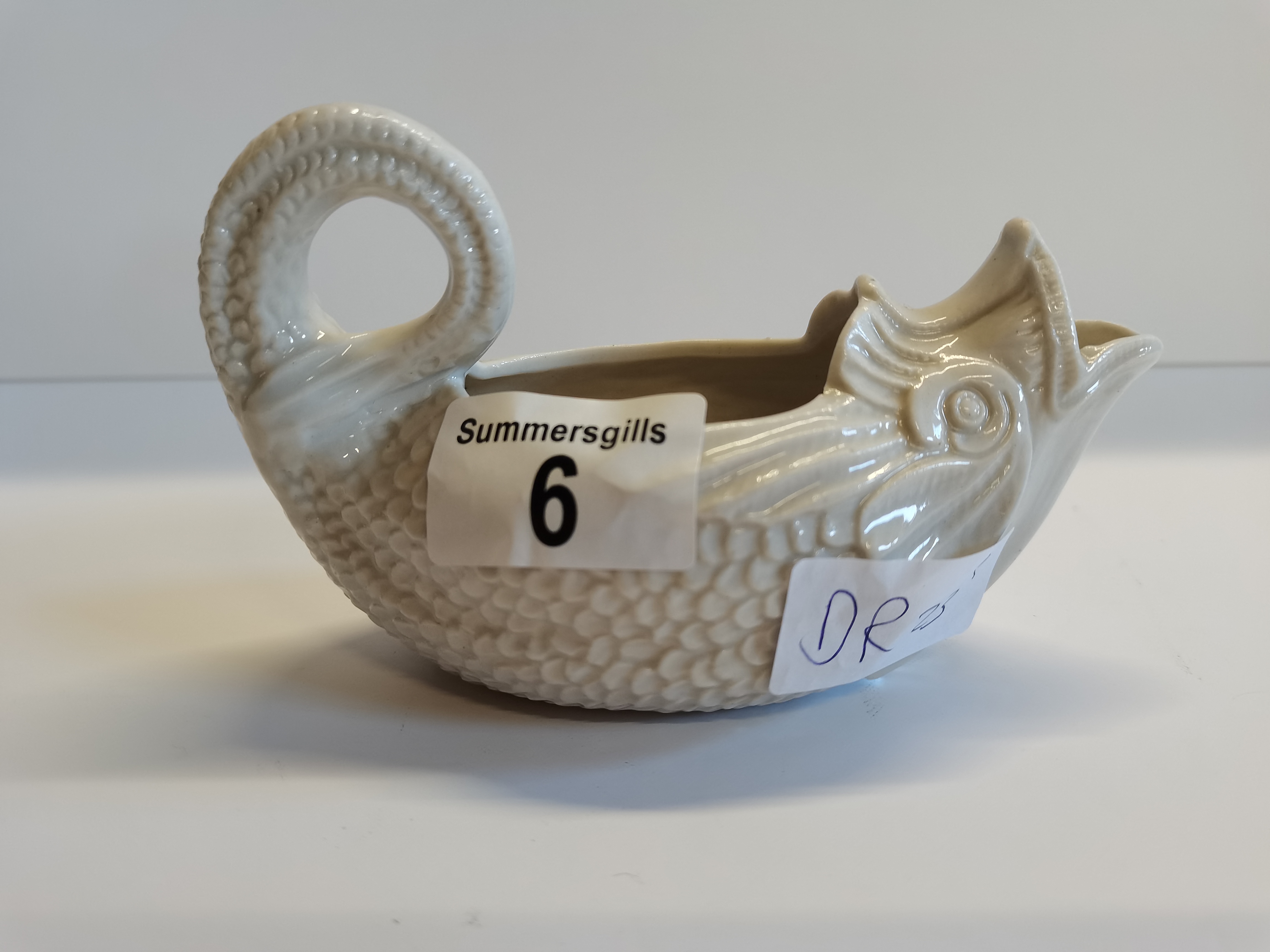 Heppell & Co white glass 1880 pap boat in the form of a fish, used for feeding children and