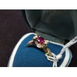 18ct 750 Gold desinger ring size P centre ruby stone with diamonds and diamond shoulders