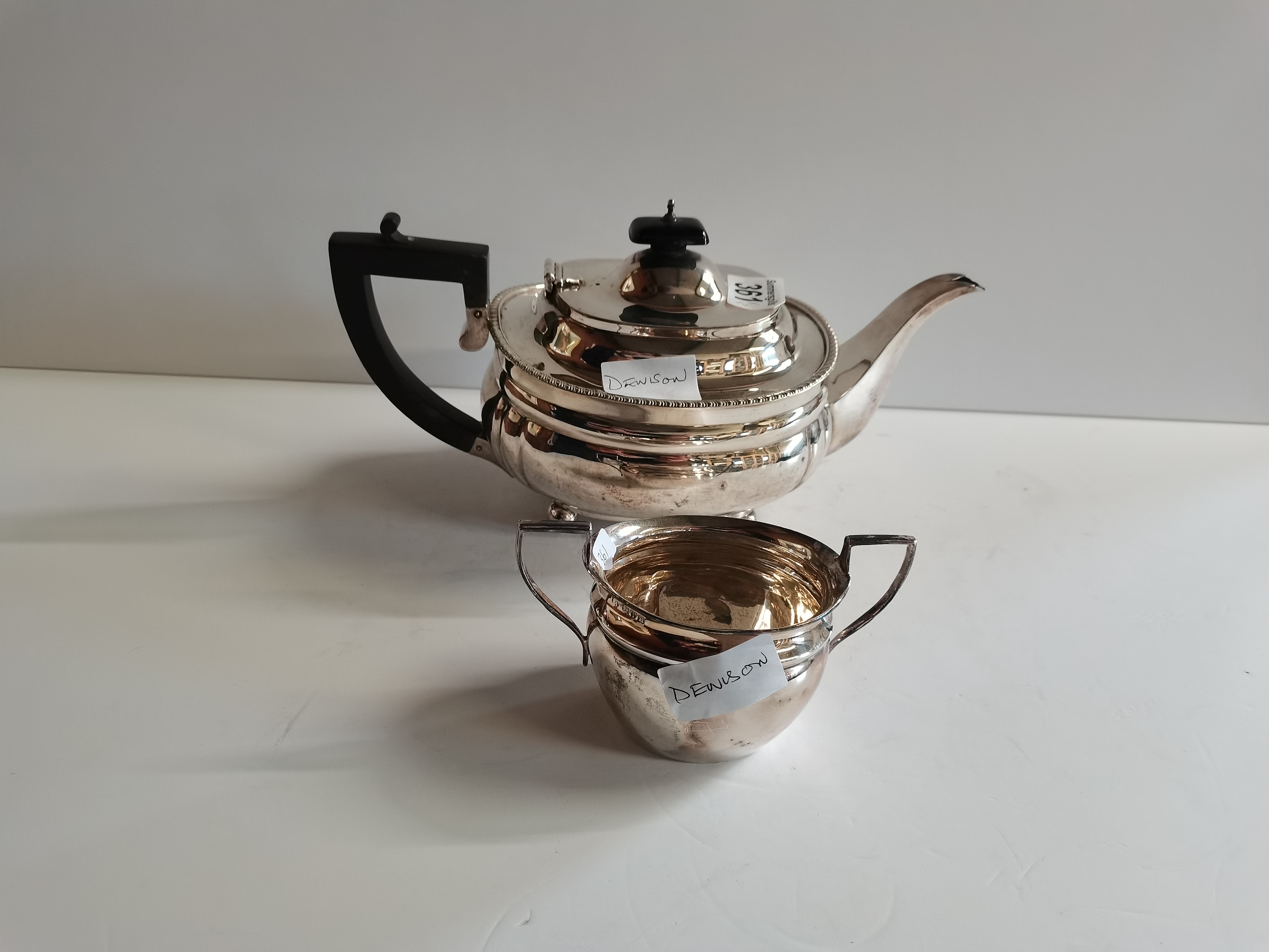 695g Silver tea pot and jug