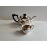 695g Silver tea pot and jug