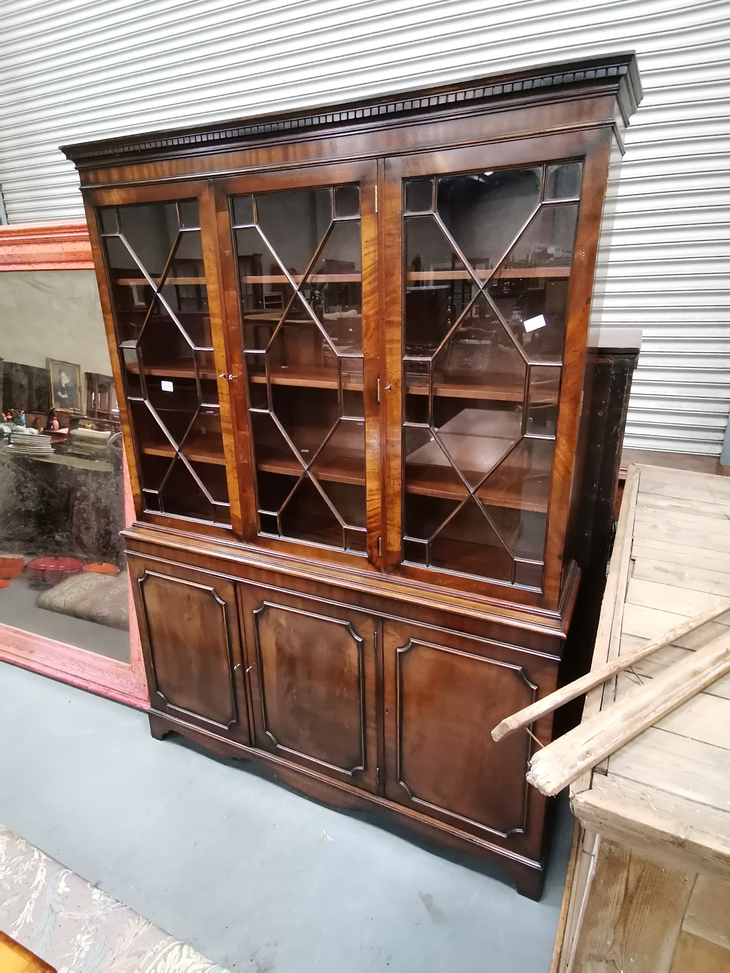 Mahogany bookcase with glazed astral top