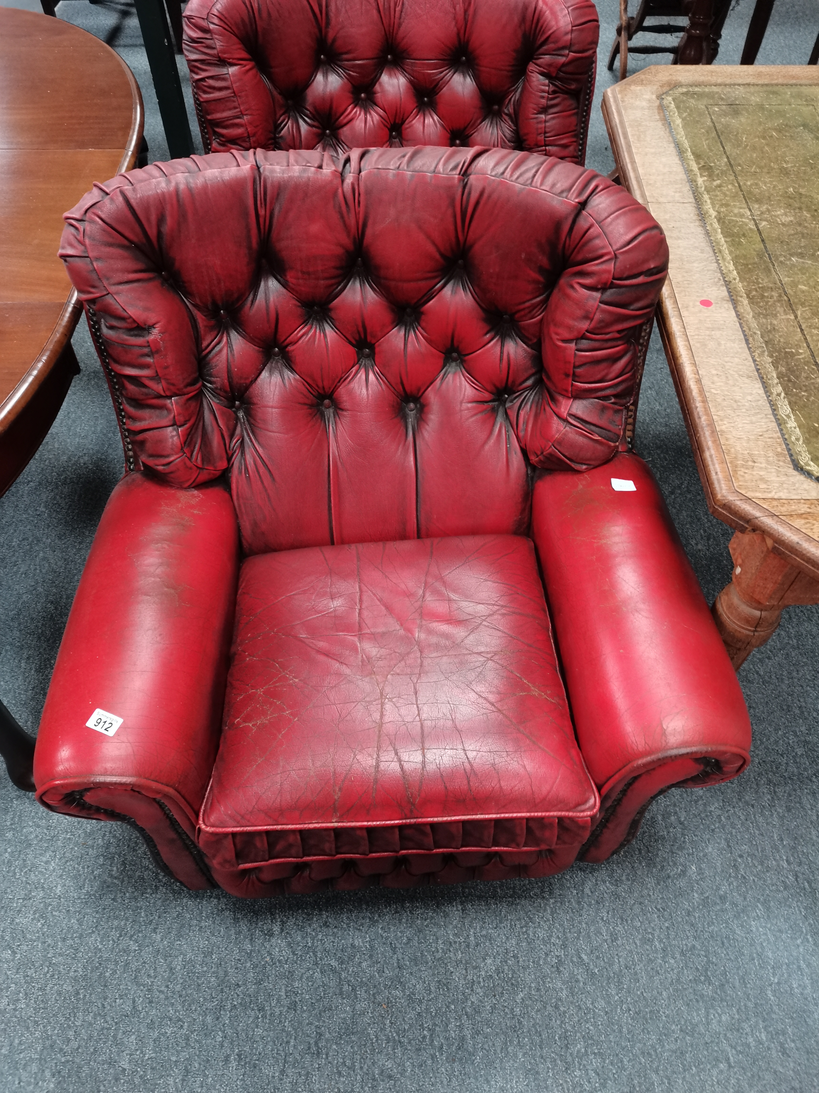 Pair of red leather suite / arm chairs