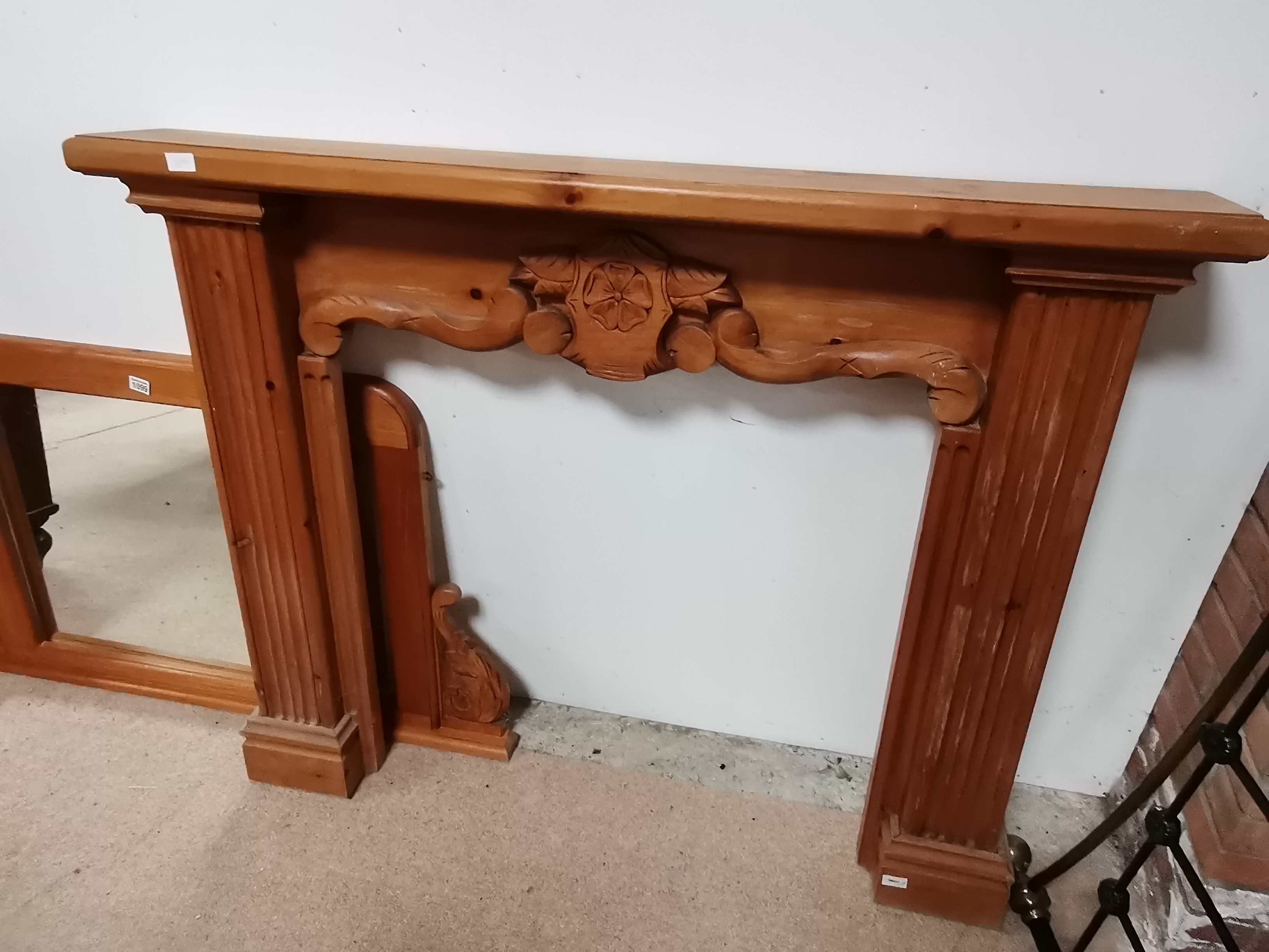 Fire surround with carved rose design and over mantle mirror