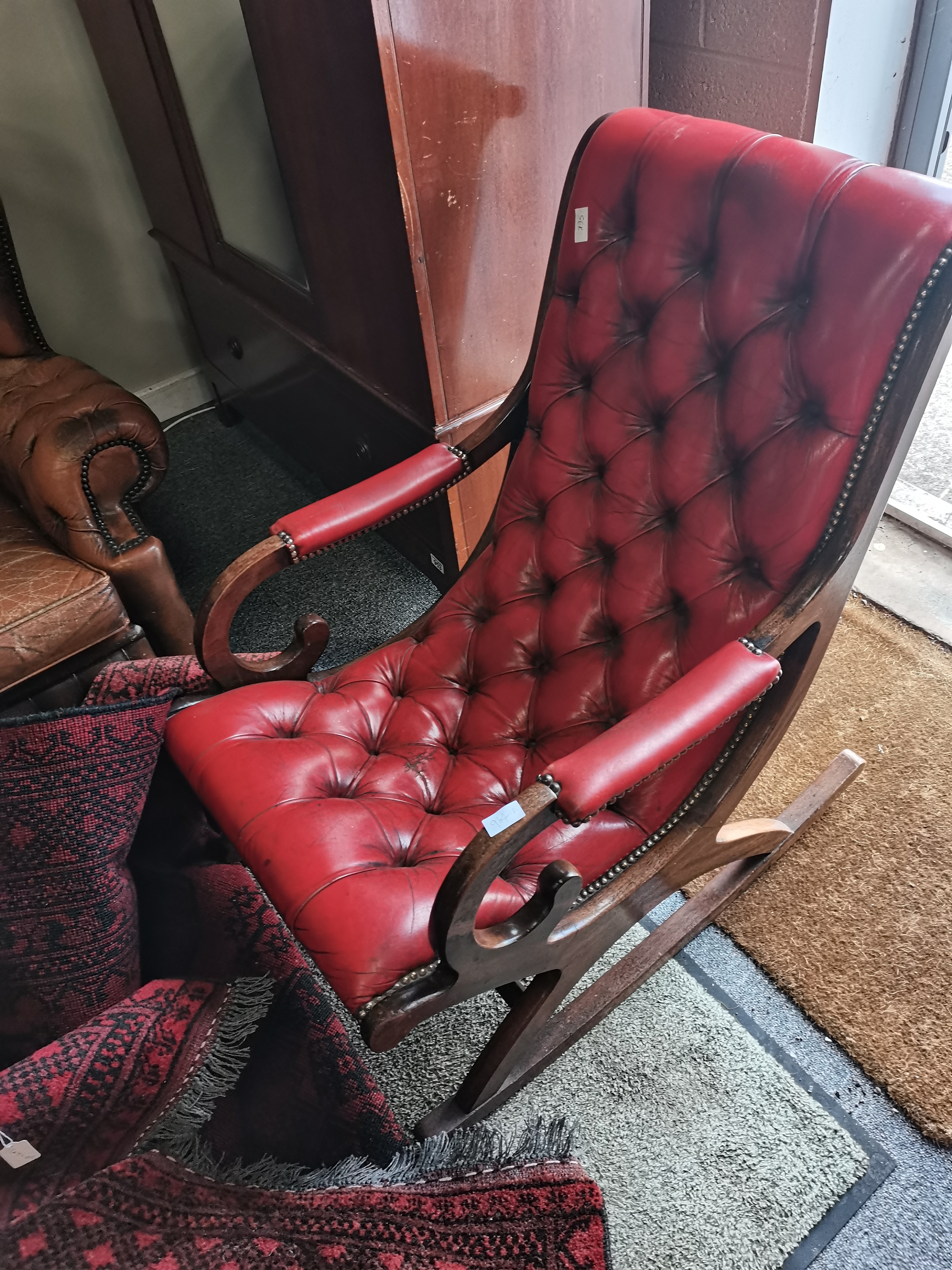 Red leather and button backed rocking chair