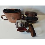 2 Cameras and a set of Binoculars