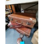 Vintage suitcases and tape measures