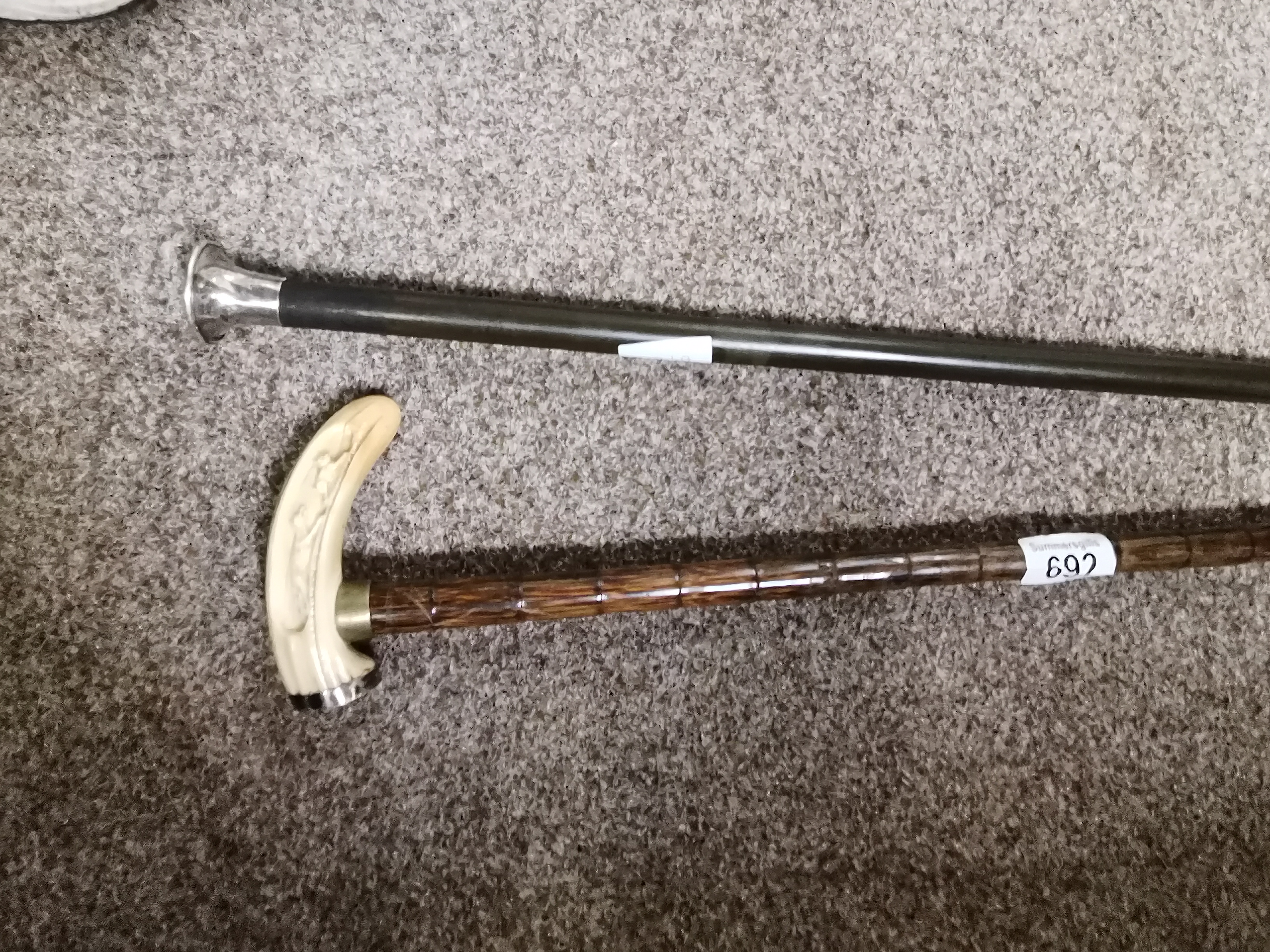 Silver topped walking stick and bone topped stick