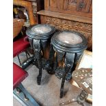 Pair of Antique plant stands heavily carved with elephants and marble topped