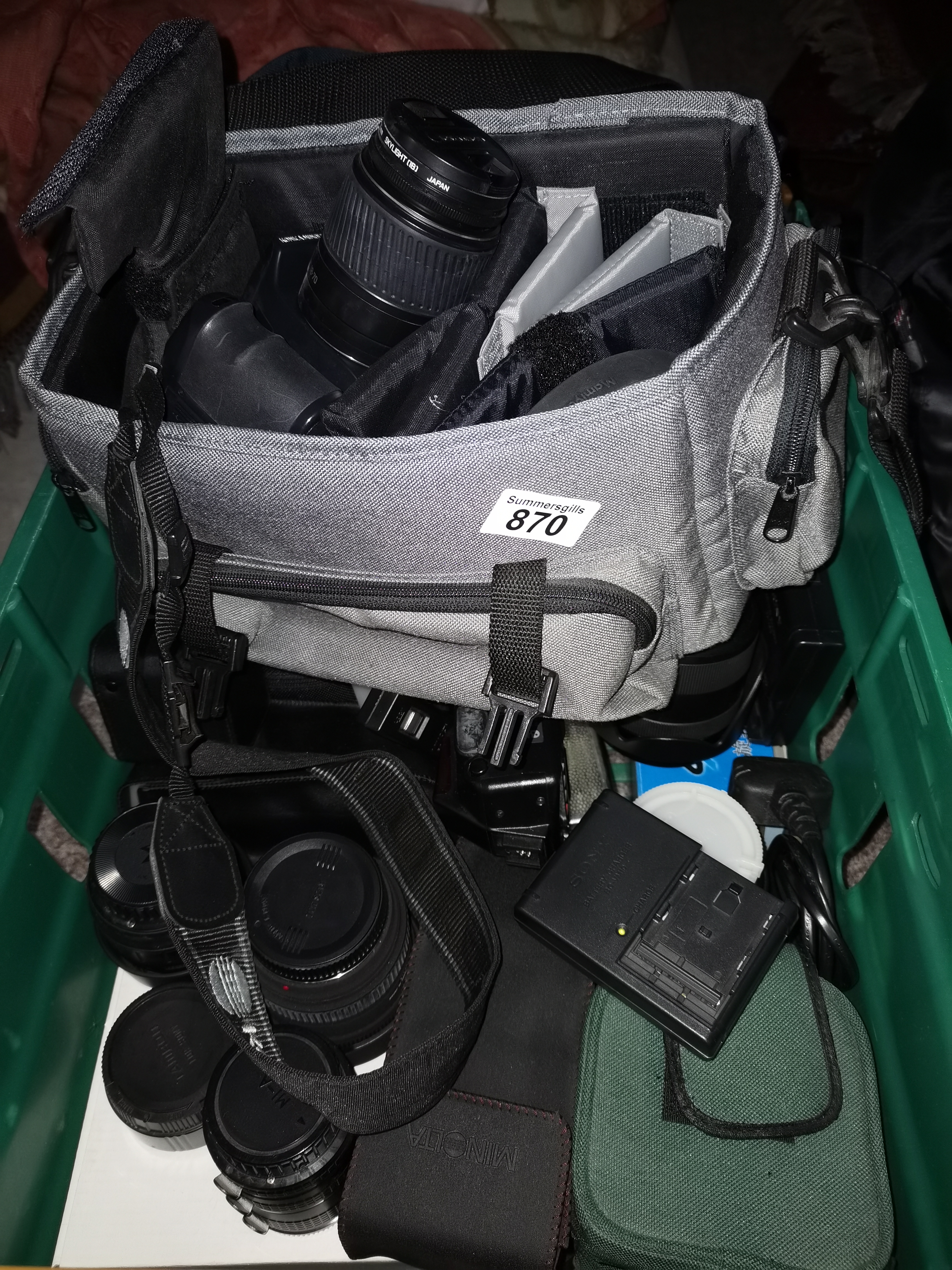 A Very Large Collection Of Photographic Equipment Including Tripods Bags Cameras and Numerous Lenses