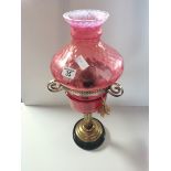 Antique ruby glass oil lamp