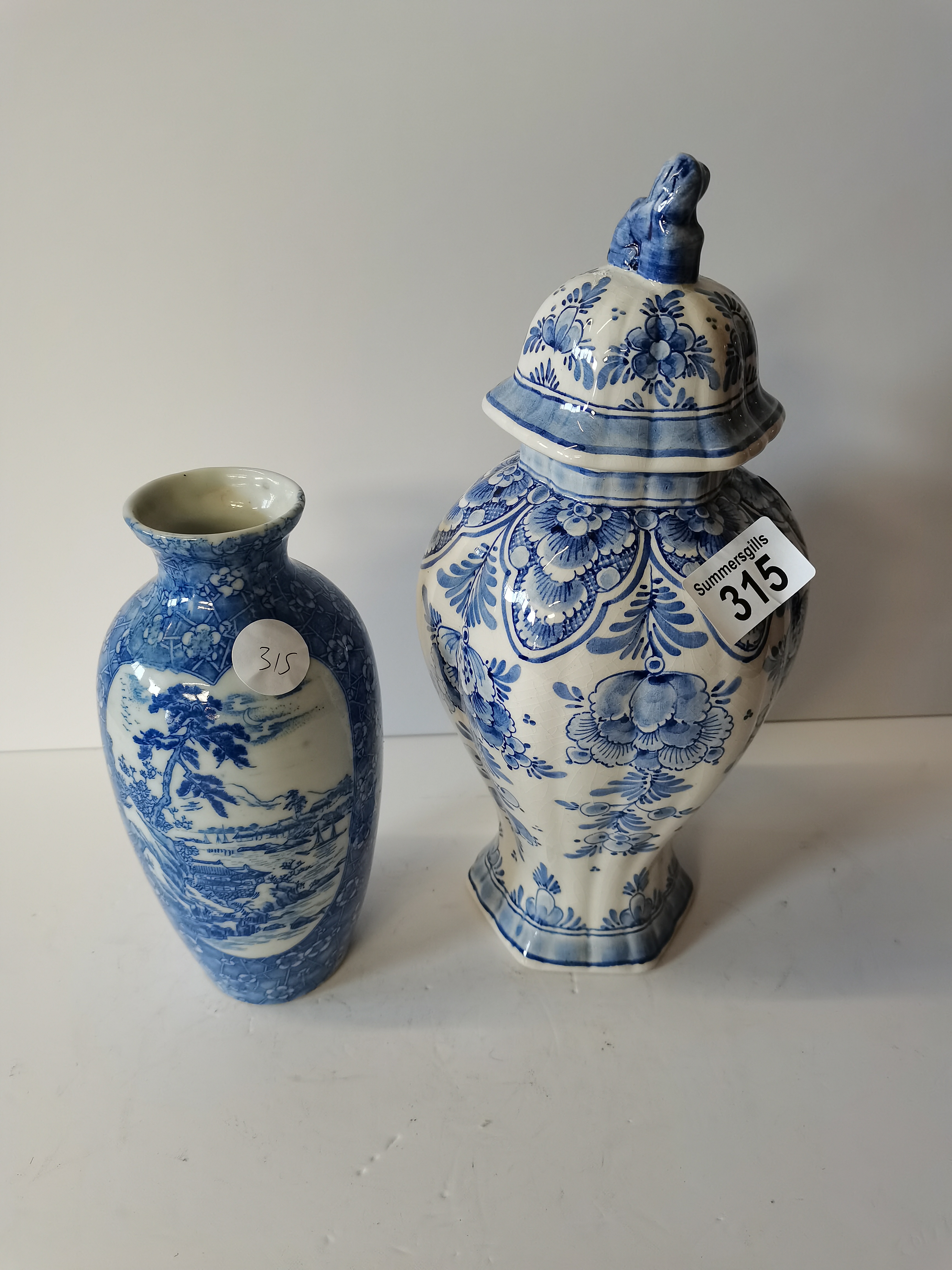 A Blue and White Vase Japanese Decoration and a Delft Vase with Lid also Blue and White