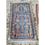 Blue and cream faded rug 130 x 72