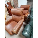 Pair of retro style tan leather armchairs